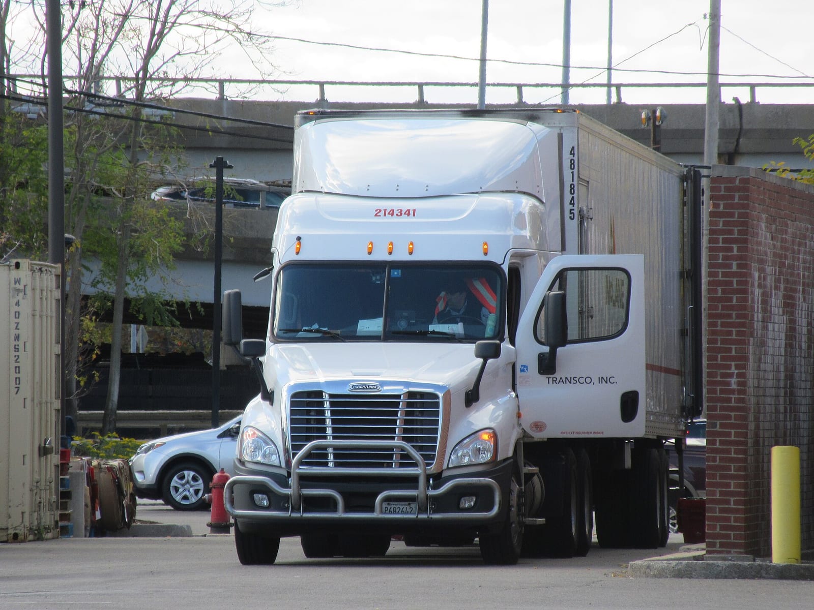 A Freightliner Cascadia semi-truck hauling a trailer on a U.S. highway