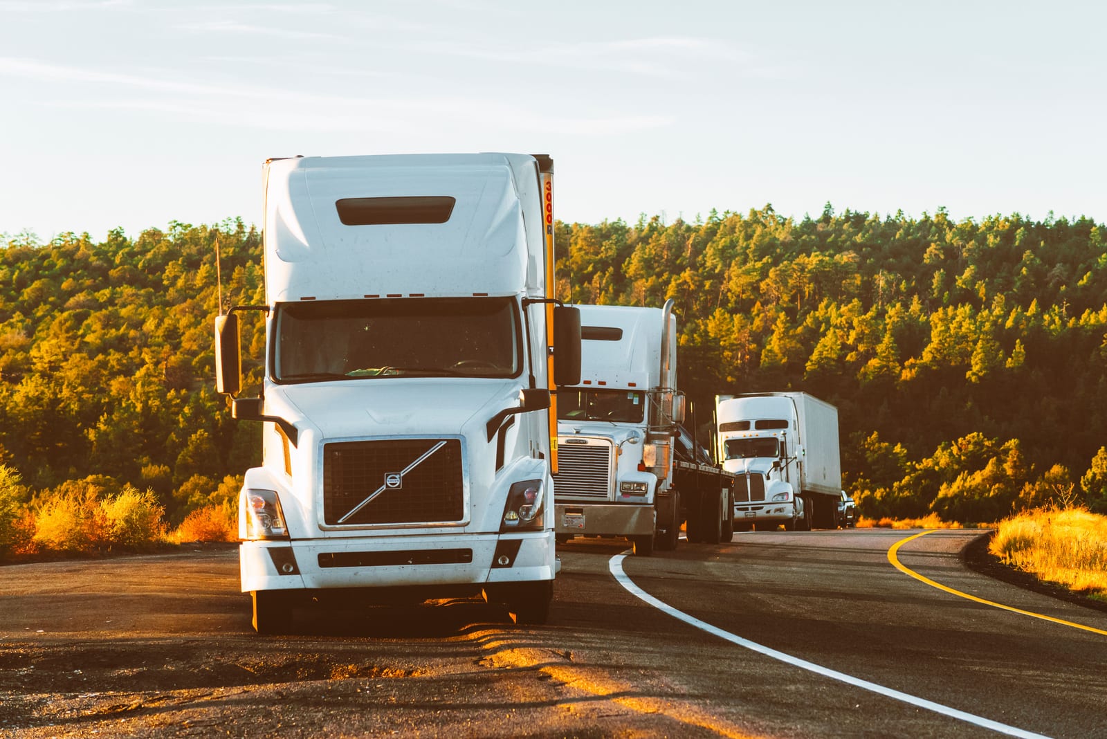 Semi-trucks driving on a highway