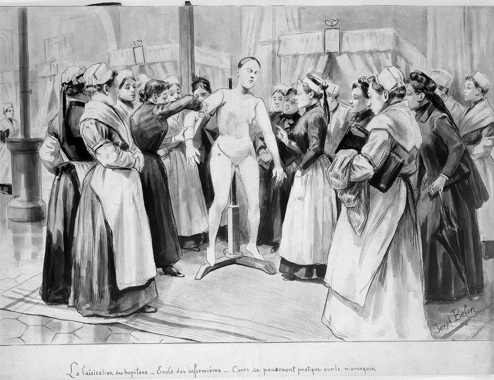 Nursing students being lectured on bandaging technique using a practice mannequin