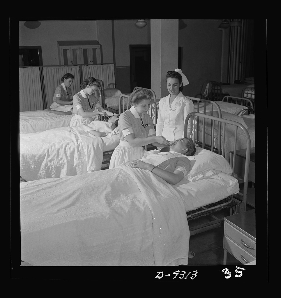 First-year nursing students practicing sick-room patient-care techniques on each other in a training program