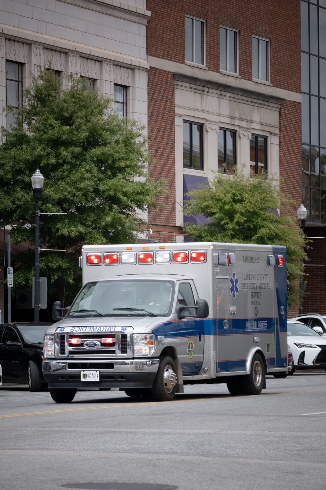 An ambulance driving down a city street